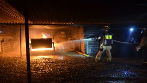 Mine rescue volunteers practice fire control and extinguishment in a controlled environment
