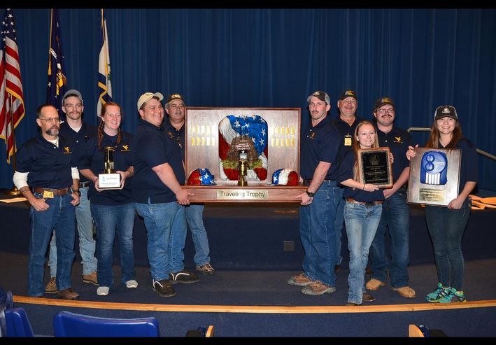 A picture of the Gold mine rescue team with trophies.