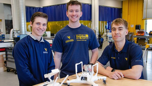 Craig Dombrowski, Lukas Thackery, and Nate Wimer with their prototype drone for their business Stork Solutions. 