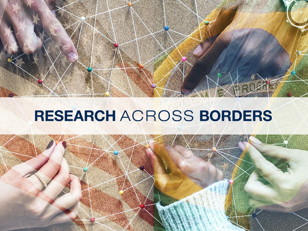 Hands shown on a flag with the text research across borders.