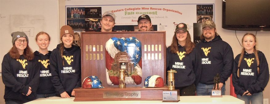 A photo of the mine rescue team with trophy.