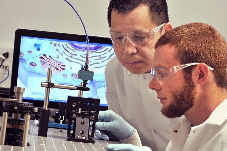 Scott Cushing performs research with his professor, Dr. Nick Wu. 
