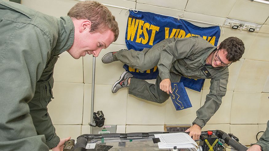 WVU students floating in a zero gravity flight simulation. 