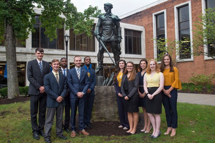 All of the students competing for the titles of Mr. and Ms. Mountaineer posing in front of the Mountaineer statue.