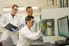 John Hu works alongside graduate students Brandon Robinson and Xinwei Bai to investigate mechanisms of microwave catalytic ammonia synthesis.