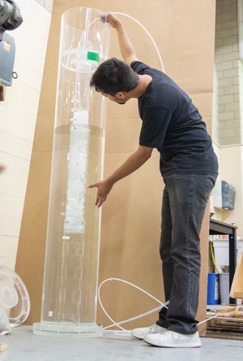 Ansan Pokharel, mechanical and aerospace engineering graduate student, tests the improved sparger design created by West Virginia University engineers. 