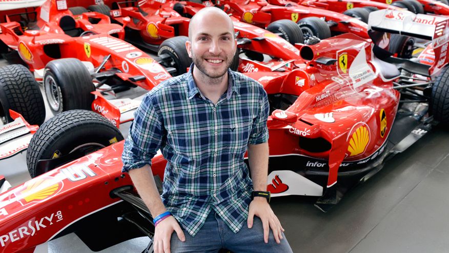 Nicco Campriani sits on the wheel of an the Shell Company F1 racer