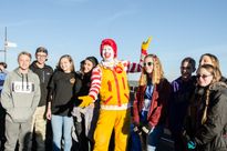 A photo of Ronald McDonald with students.