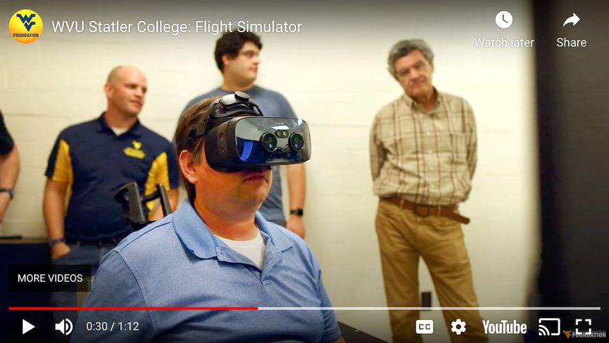 YouTube image capture of Teaching Associate Professor Dr. Christopher Griffin partiicipating in a virtual flight simulation.