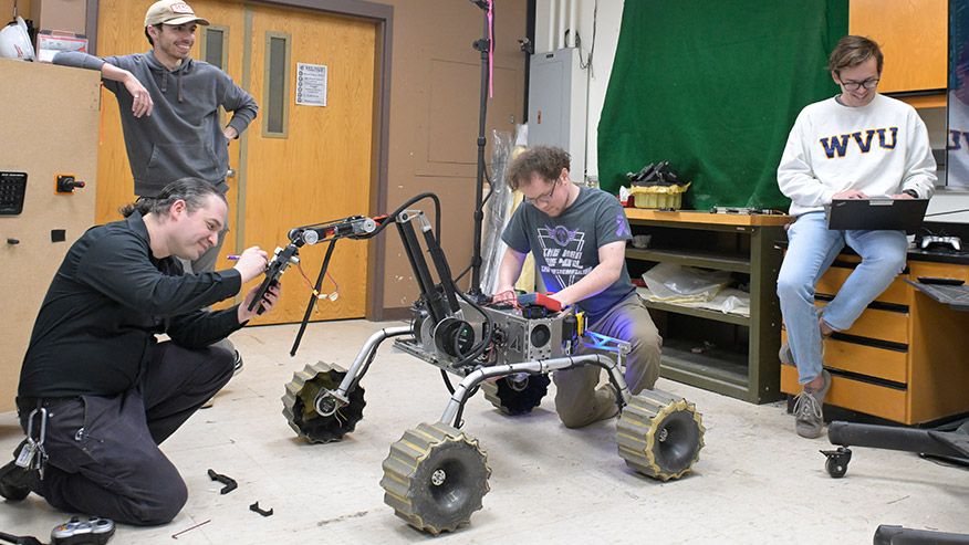 Students working on University Rover Challenge robot.