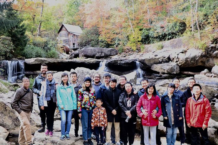 Late West Virginia University Professor Yi Luo (far left) often organized off-campus activities for mining engineering graduate students, visiting scholars and their families, including a spring trip to Babcock State Park in Clifftop, West Virginia.