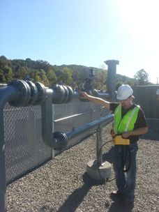A photo of a researcher taking methane emissions measurements.