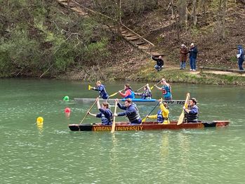 Students racing in the concrete canoe