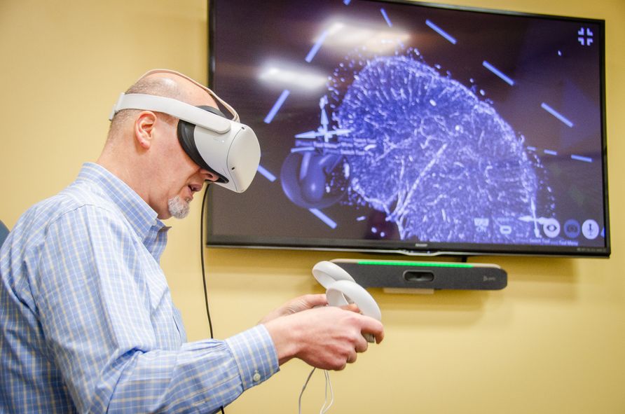 Gianfranco Doretto, a computer scientist at West Virginia University, views an enormous, highly detailed scientific image in immersive 3D using syGlass, the virtual reality software he developed.