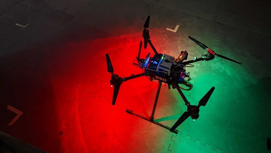 A Black drone placed on the floor
