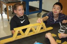 Max Kemp-Rye building a bridge out of pasta noodles at a WVU engineering camp in 2012