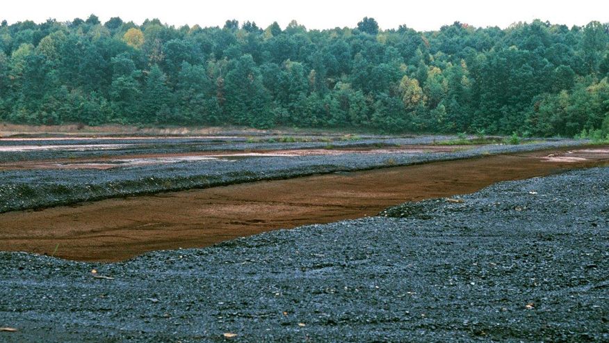 An image of coal mining waste in a field located in Upshire County, West Virginia
