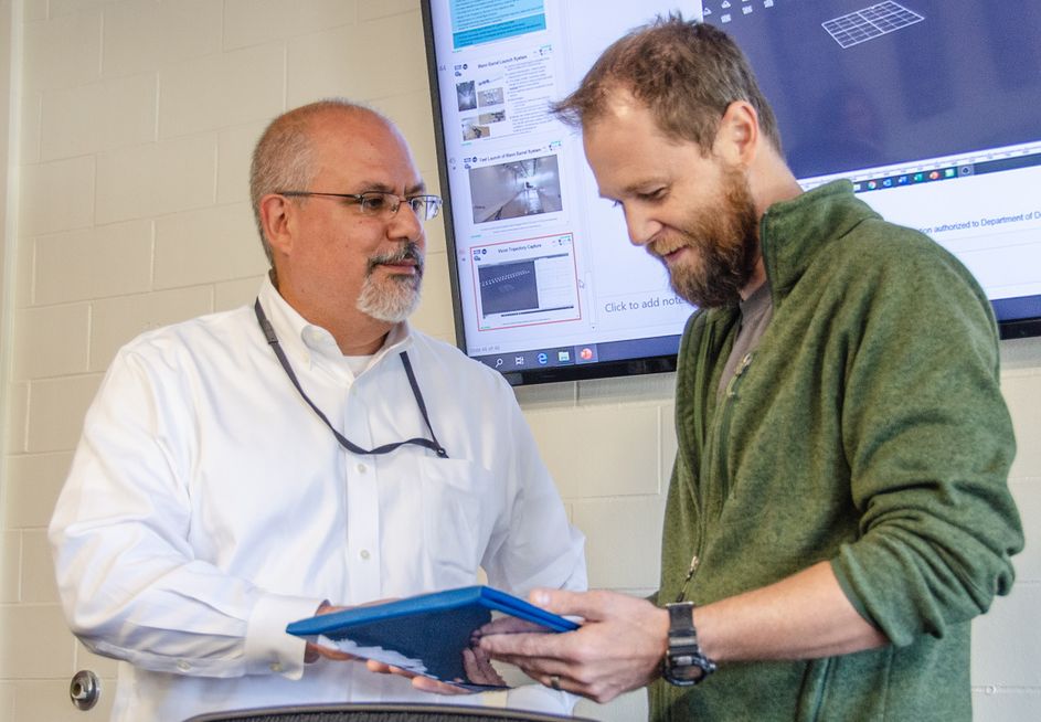 John Fiore awards Patrick Browning with research award from U.S. Navy