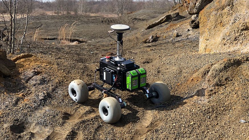Pathfinder, a lightweight, small-scale test rover, roams an ash pile in Point Marion, Pennsylvania