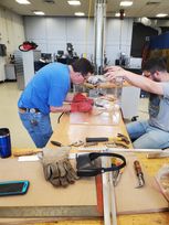 Jim Hall, chemical engineering senior lab instrumentation specialist, and Kelsey Crawford, Innovation Hub shop manager, assemble an intubation box. 