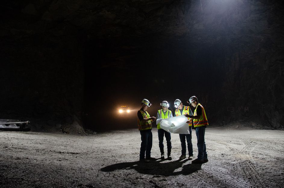 Berk Tulu studies a map with personnel from Laurel Aggregates, a large surface and underground limestone quarry near Morgantown.