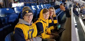 Billy with his brother and mom at a WVU football game