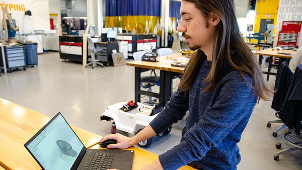 Dylan Printy working on a computer model of a 3D printed part. 
