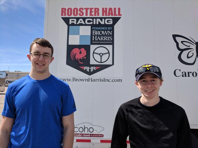 Justin Moser and Mark Ziegler with the Rooster Hall Racing vehicle trailer. 