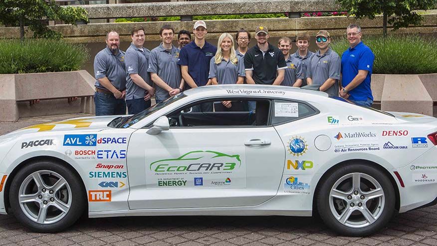 A photo of the EcoCAR 3 team with the Camaro.