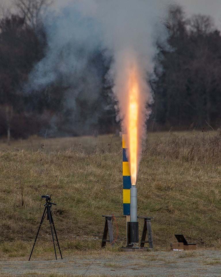 A photo of a rocket test firing.