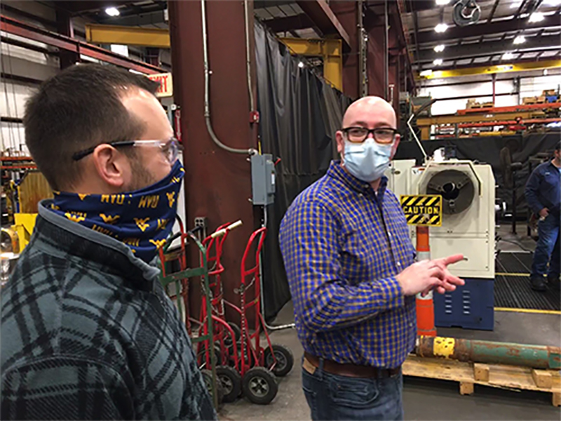 West Virginia Manufacturing Extension Partnership Manager of Continuous Improvement Randy Kowalczyk (left) discusses ideas for operational streamlining with Justin Skeens (right), operational manager of brake supply. (Submitted Photo)