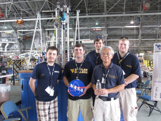 A picture of the MIDAS team in front of their robot.