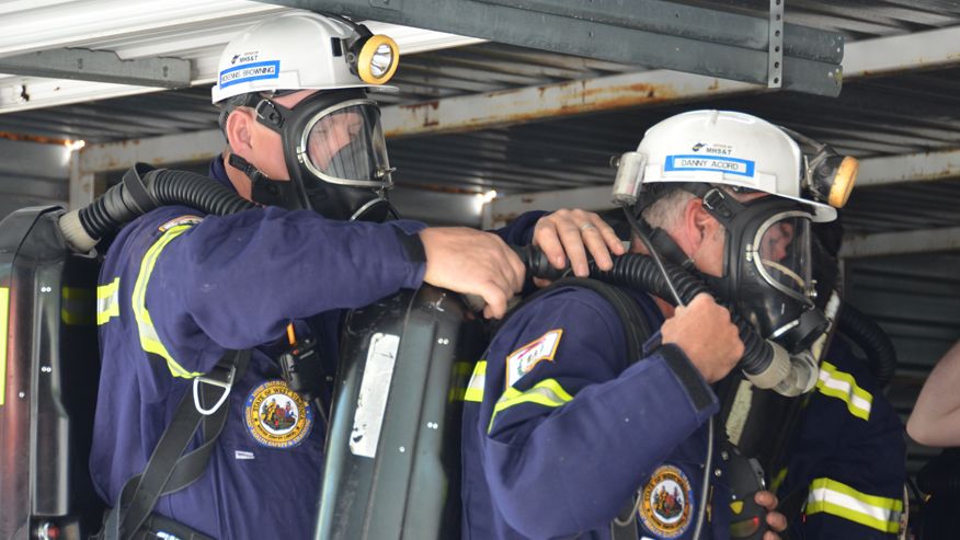 Mine rescue volunteers equip their safety gear