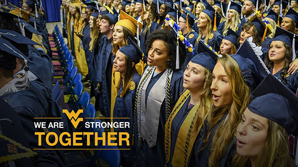 WVU students at graduation - Flying WV logo - We are stronger together